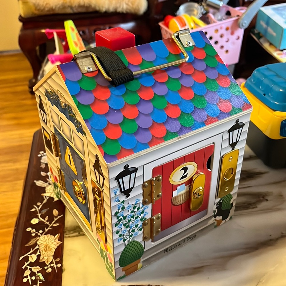 Melissa and Doug four door house toy used with working keys and bell